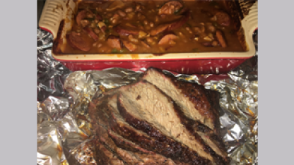 Smoked beef brisket with smoked baked beans and roasted potatoes